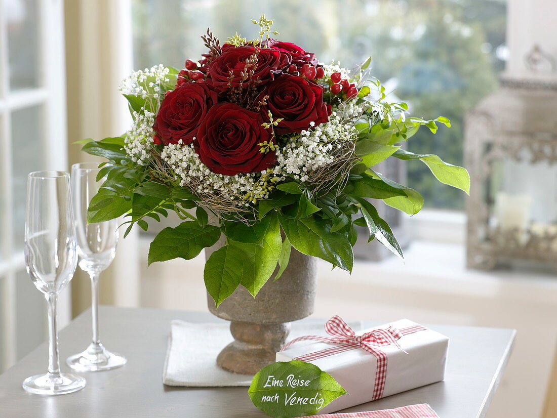 Bouquet of dark red pinks (roses), Gypsophila (baby's breath)