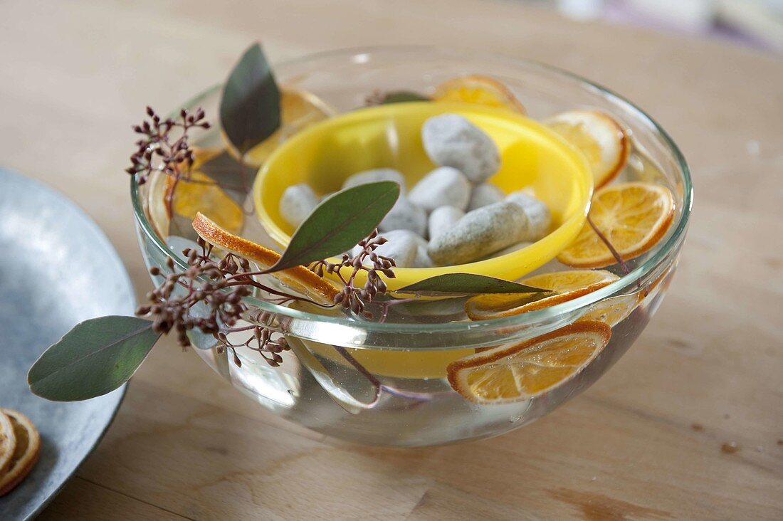 Homemade ice lanterns with orange slices 3/6