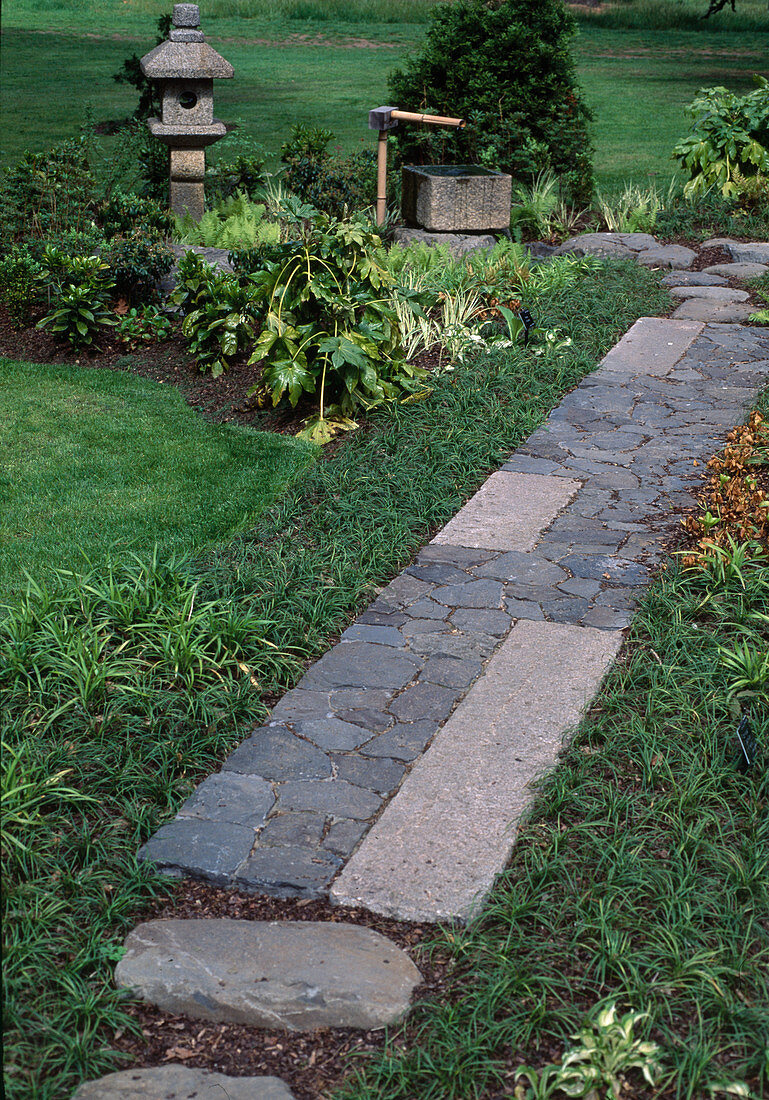 Path of natural stones with water feature