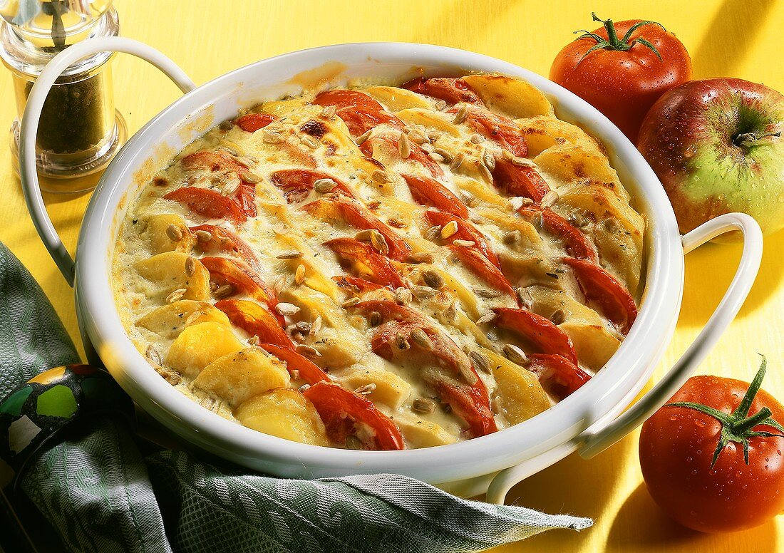 Potato and tomato bake with sunflower seeds