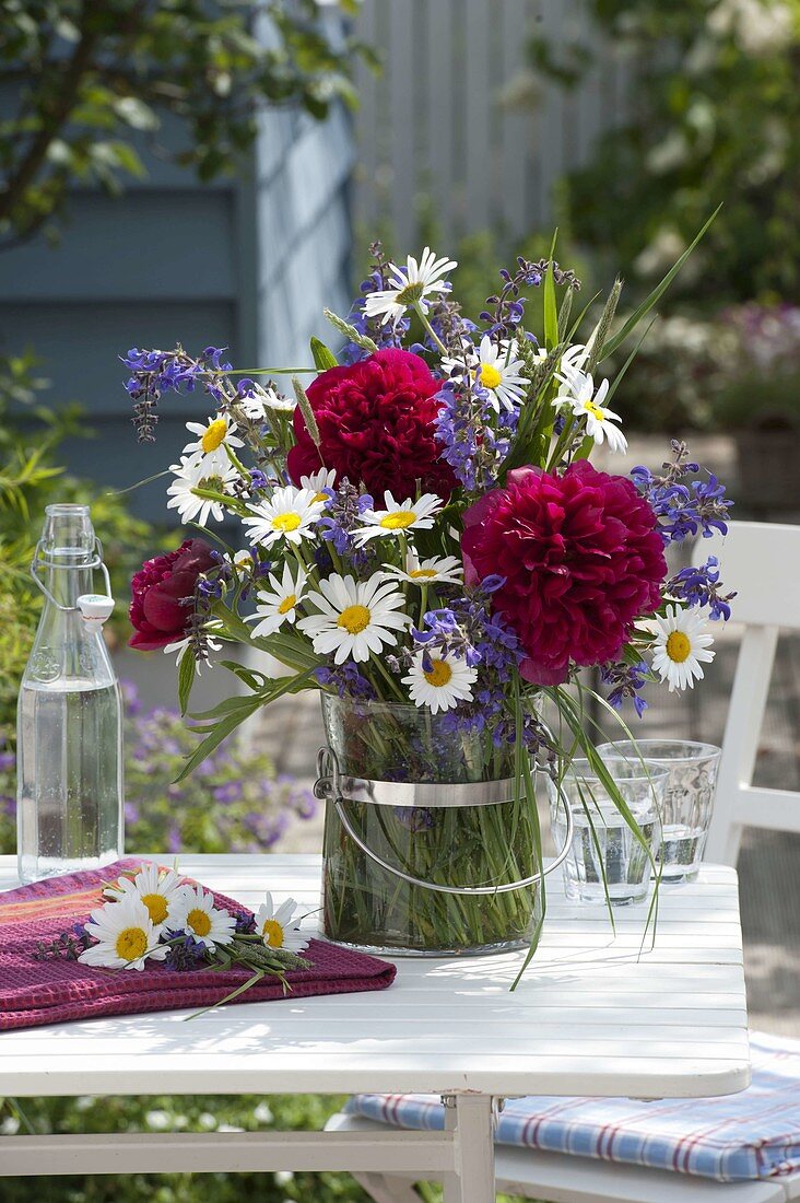 Early summer bouquet of Paeonia (peonies), Salvia pratensis