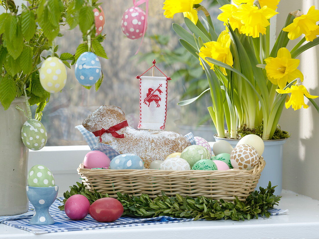 Easter lamb in basket with Easter eggs