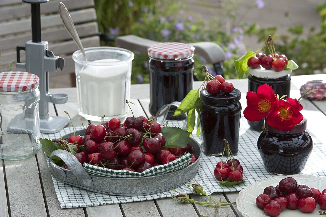 Cherries canning jars with jelly, cherries, sugar