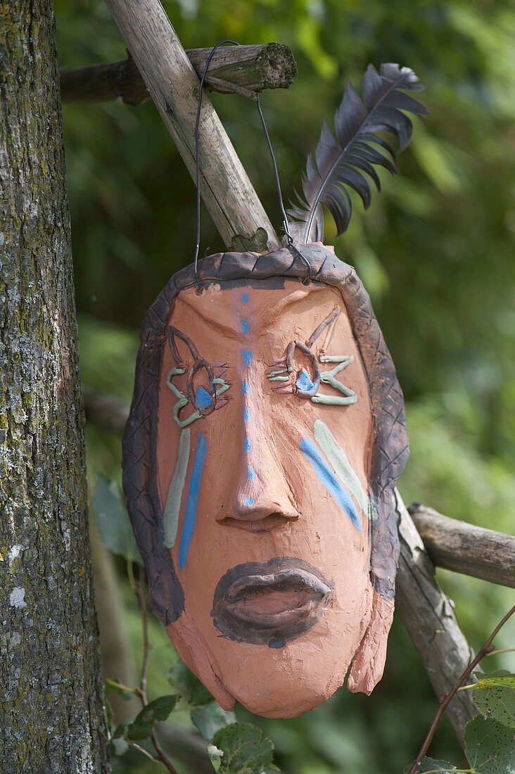 Homemade Indian mask as garden decoration