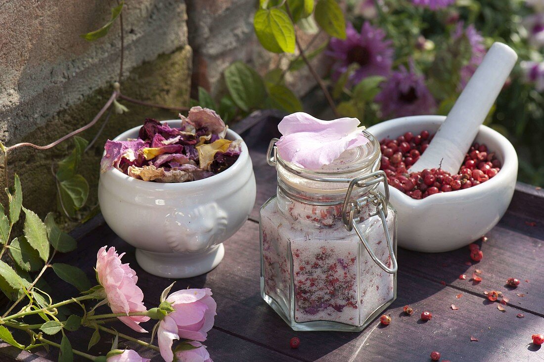 Sugar with pink (rose) and pink pepper (Schinus) flowers