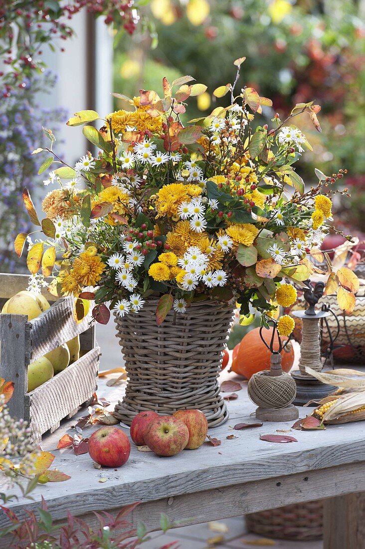 Rural autumn bouquet in basket vase