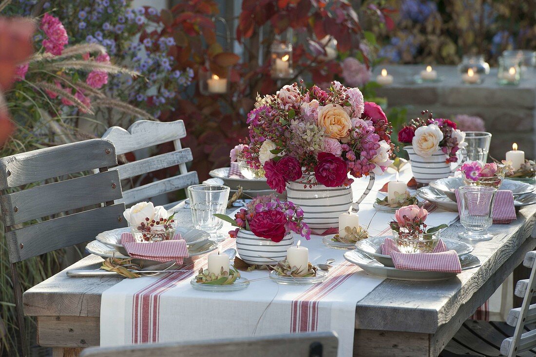 Autumnal rose table decoration on the terrace