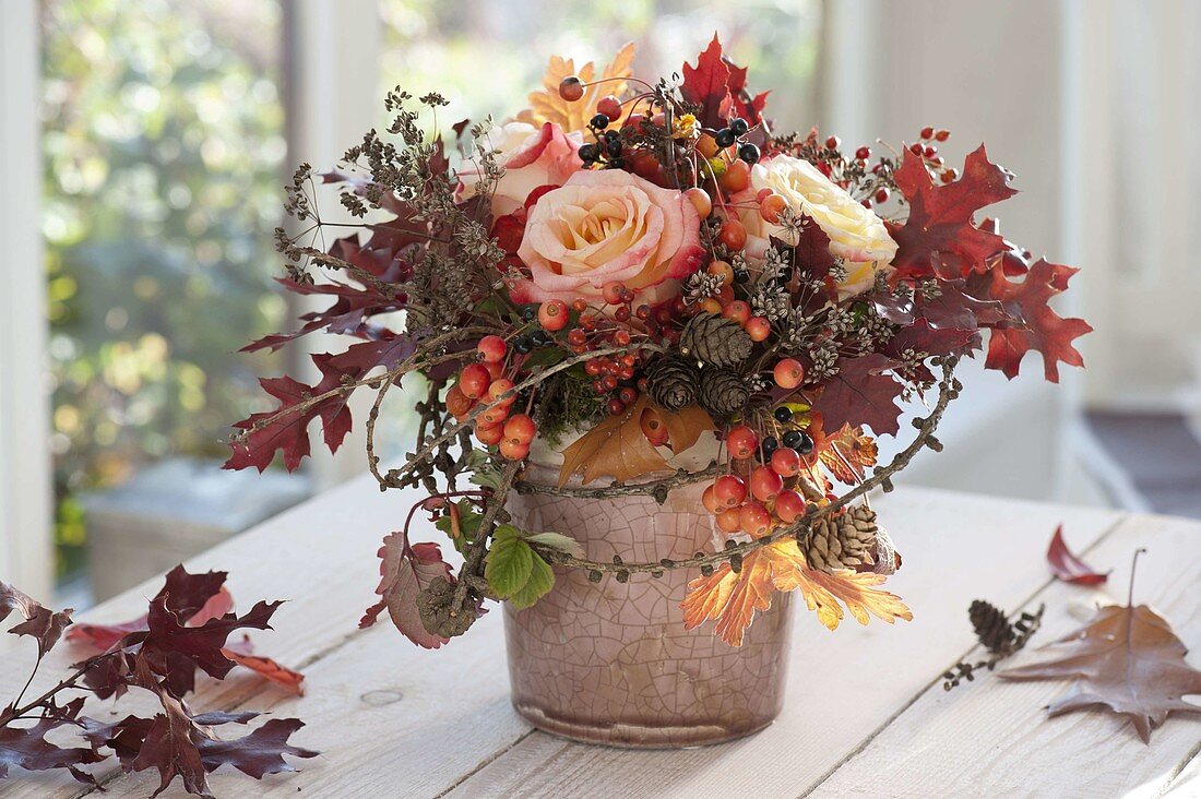 Late autumn bouquet with pink (roses, rose hips), Quercus (oak), Larix