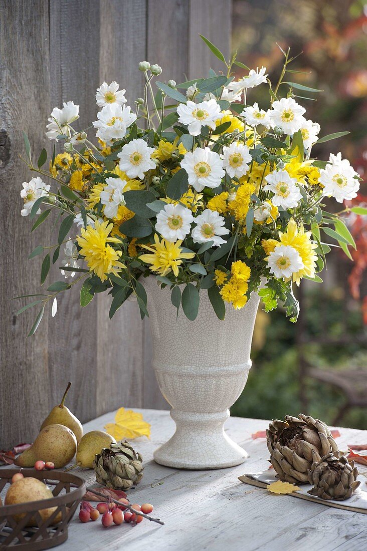 White-yellow autumn bouquet with anemone japonica (autumn anemone)