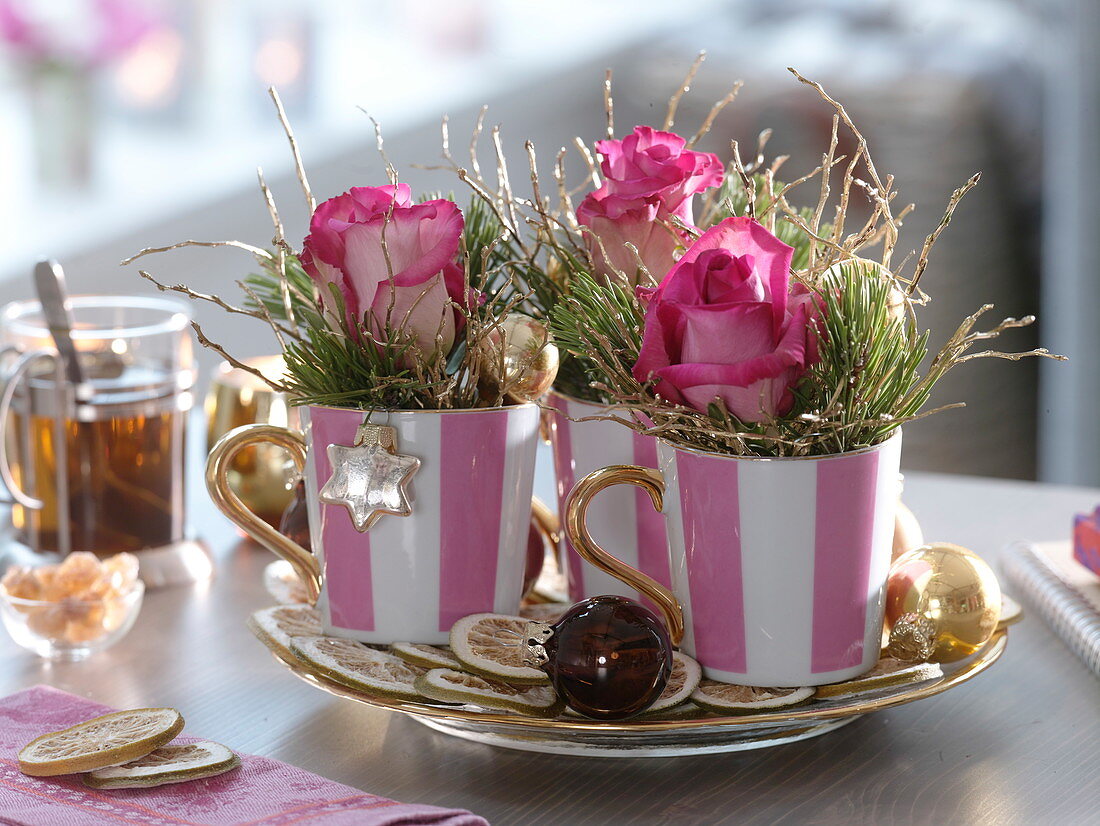 Christmas decoration with pink (roses), Pinus (pine), gilded branches