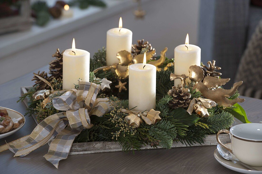 White-gold Advent wreath with white candles