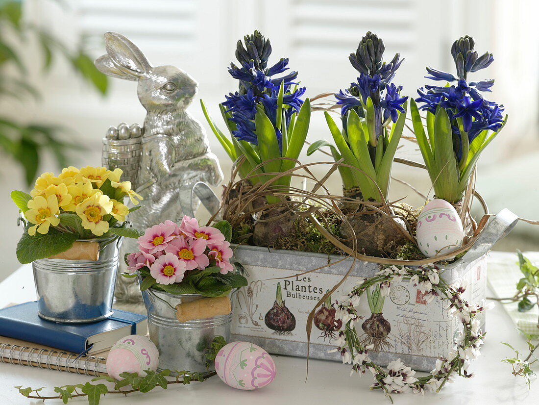 Metal containers with spring flowers