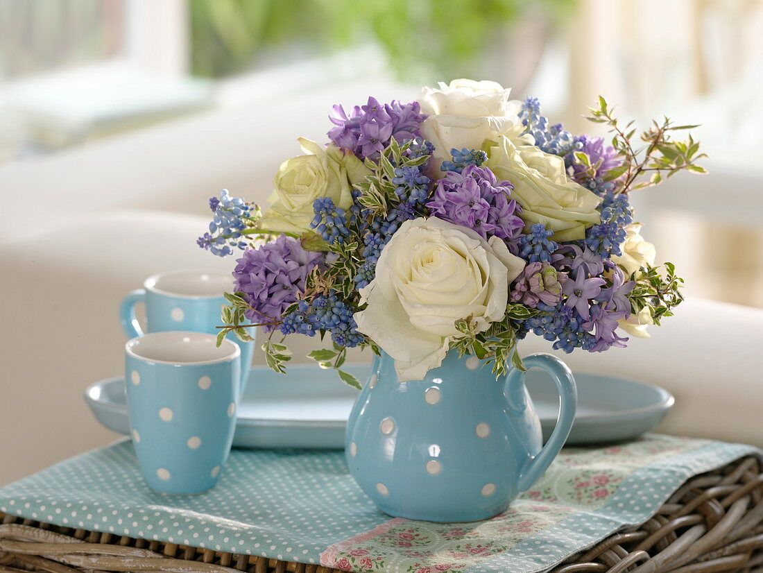 Blue and white bouquet of pink (roses), hyacinthus (hyacinths), muscari