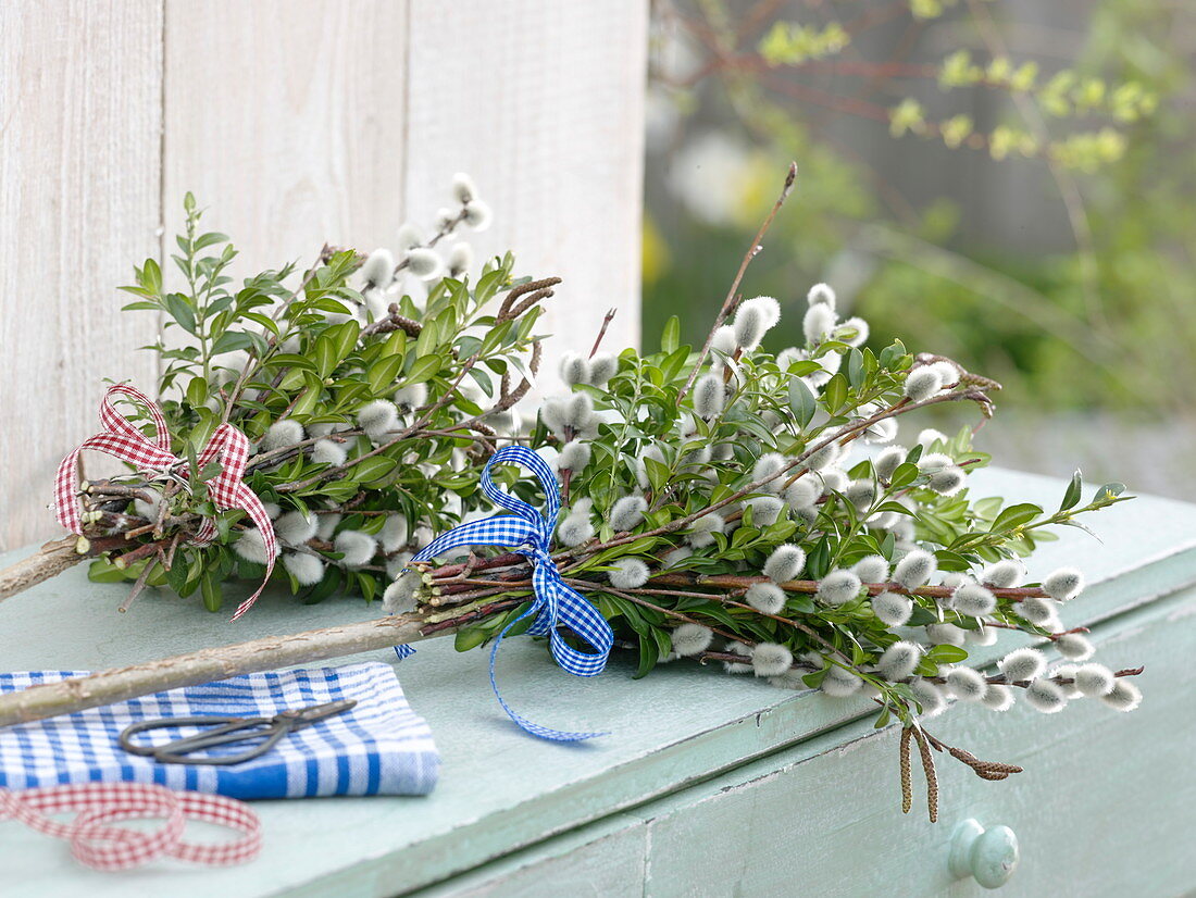 Bound palm bouquets made from branches of Salix (catkin willow)