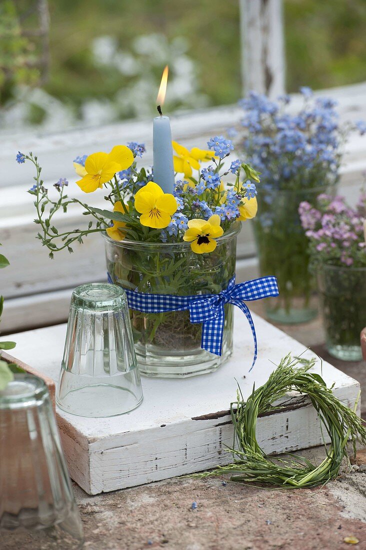 Small viola cornuta (horned violet) and myosotis bouquet