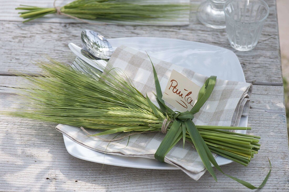 Bouquet of Hordeum (barley) as napkin decoration, grass as bow ribbon