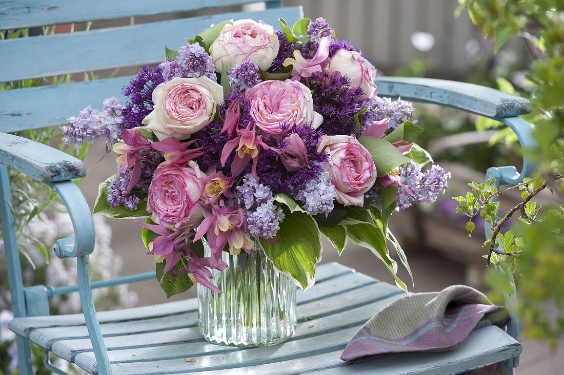 Fragrant spring bouquet of Rosa (roses), Syringa (lilac), Allium