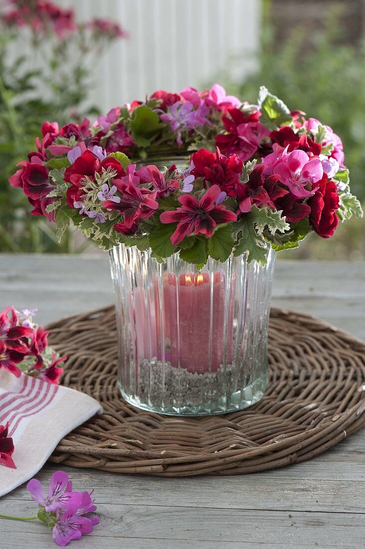 Lantern with wreath of Pelargonium (geranium) flowers and leaves