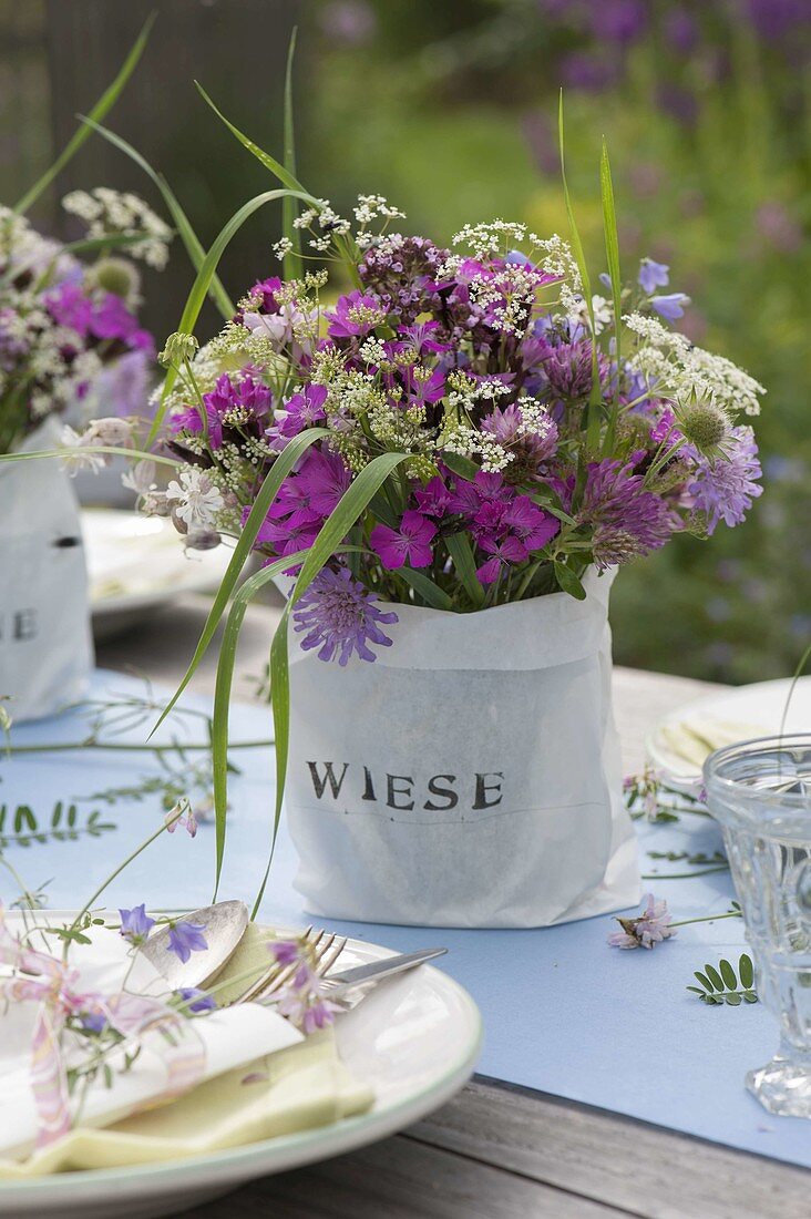 Summer table decoration with meadow flowers