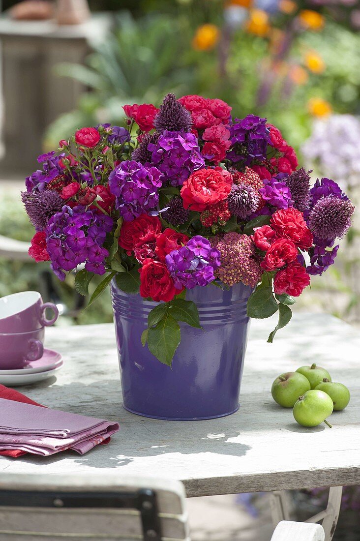 Red-purple bouquet with Phlox paniculata (flame flowers), Rosa (roses)