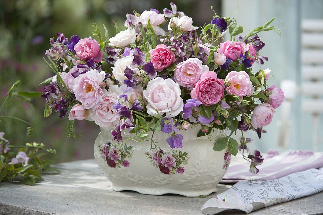 Romantic arrangement of pink (roses) and Lathyrus odoratus