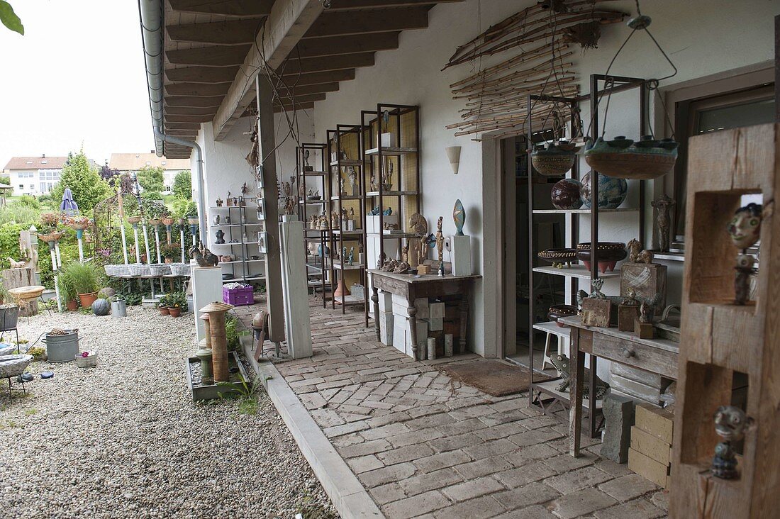 Outdoor area of the pottery workshop with potted decorative elements