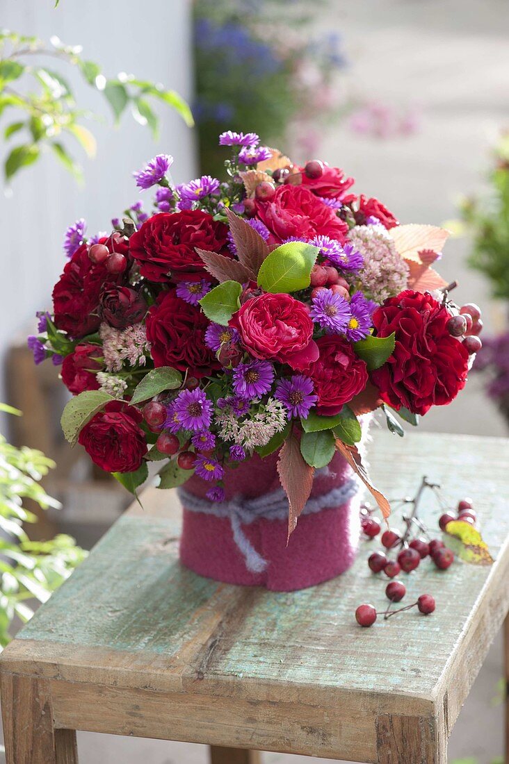 Autumn bouquet with Rosa 'Red Eden' 'Red Leonardo' (roses), Aster