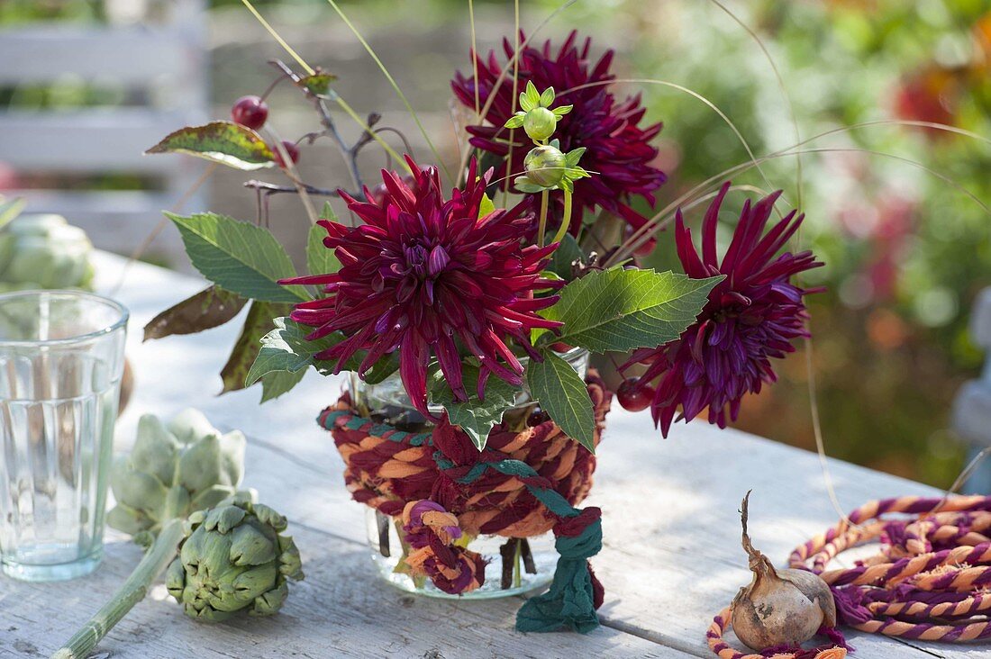 Small bouquet of Dahlia 'Black Star' (cactus dahlias), artichokes