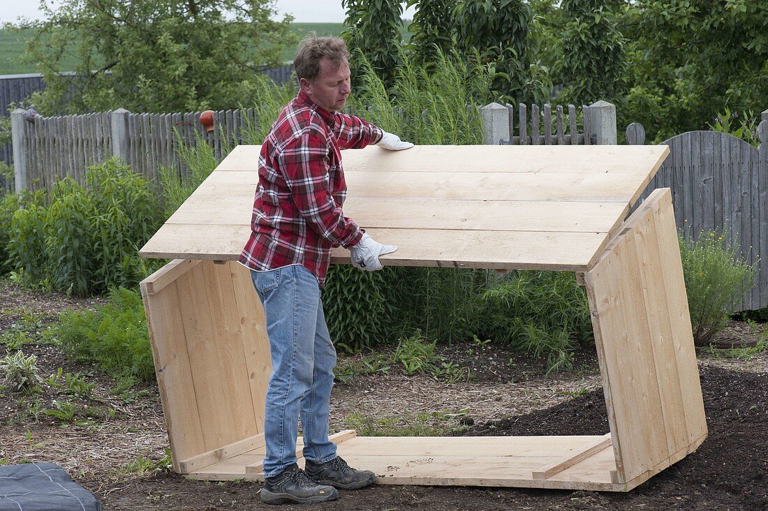 Build a raised flower bed of boards