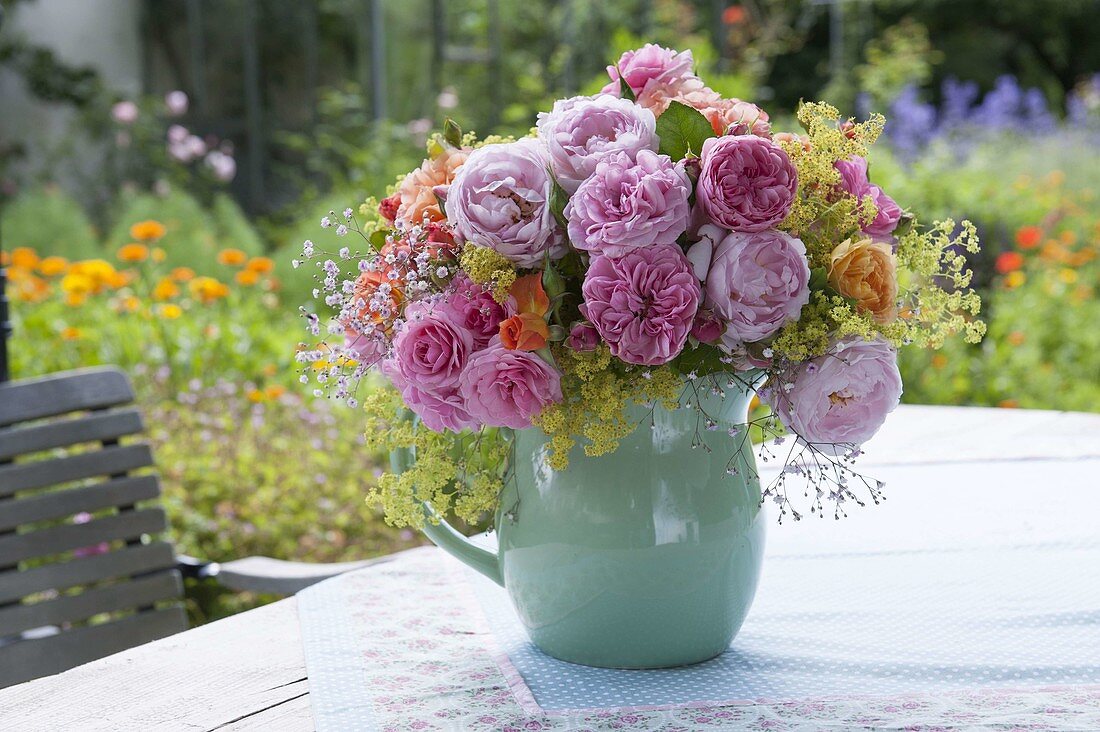 Summer bouquet of Rosa (roses), Alchemilla (lady's mantle) and Gypsophila