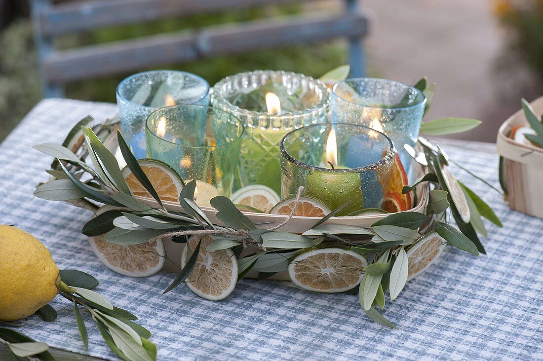 Small lanterns in a chip box, garland made of branches of olea (olive)