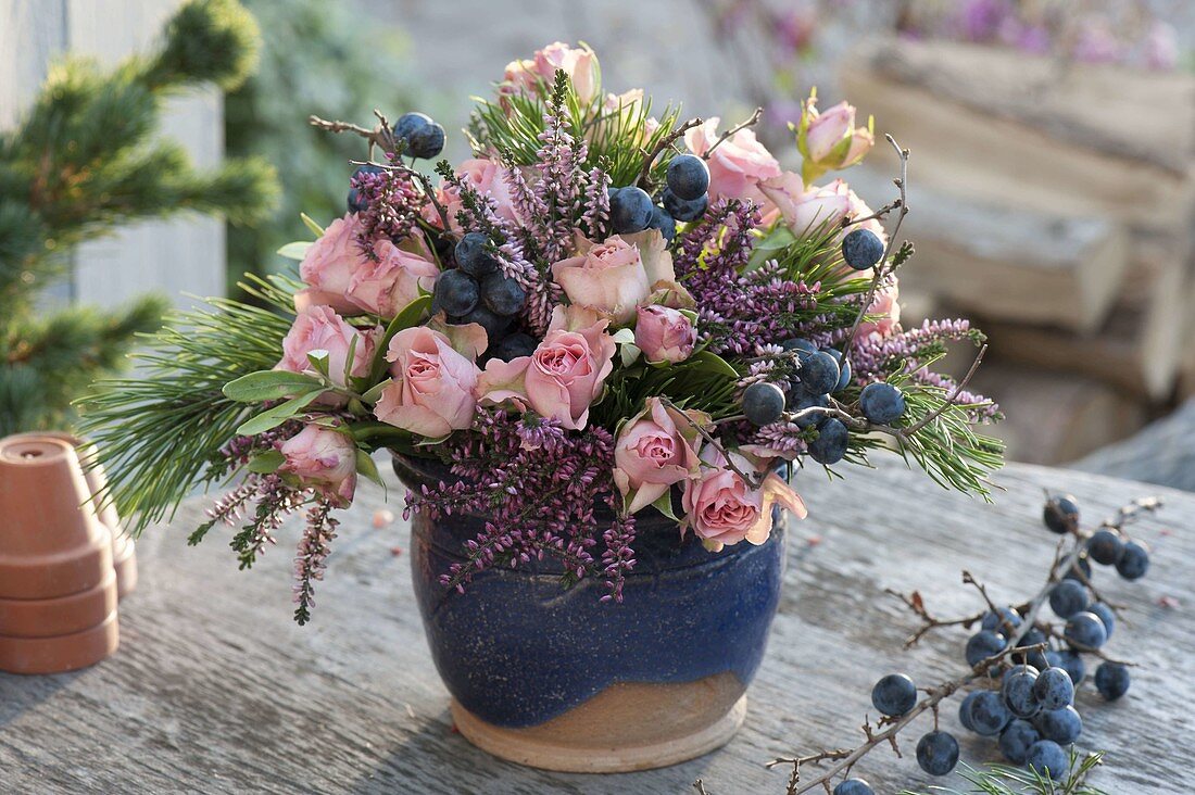 Autumn bouquet of pink (roses), Pinus (pine), Blackthorn (Prunus spinosa)