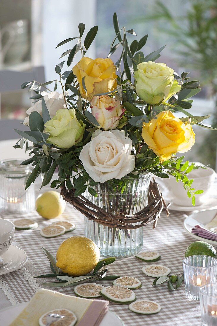 Yellow bouquet of Rosa (roses), branches of Eucalyptus, Pistacia (pistachio)