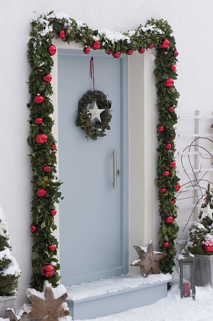 Decorate front door with garland for Christmas