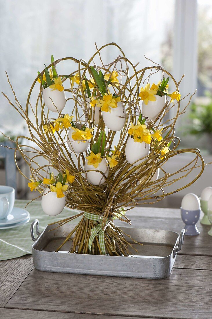 Standing bouquet of willow with eggshells as vases