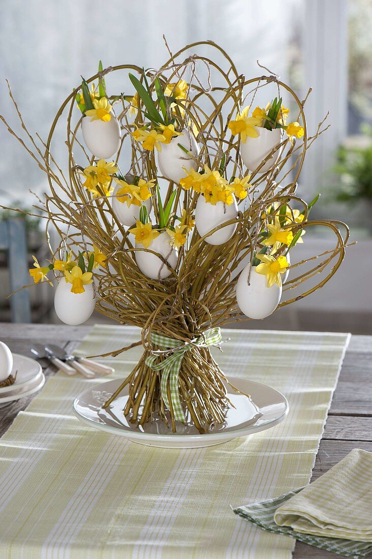 Standing bouquet of willow with eggshells as vases