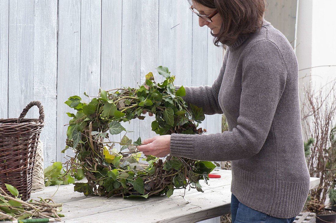 Tie ivy wreath to door