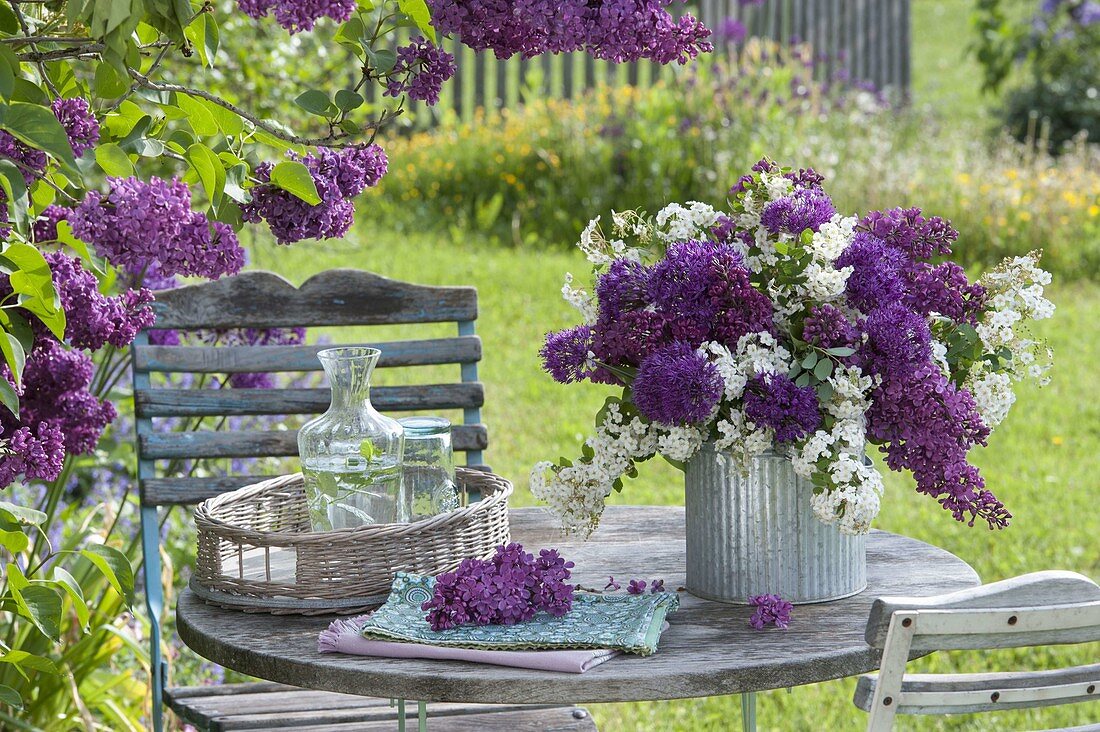 Bouquet of spiraea, syringa and allium