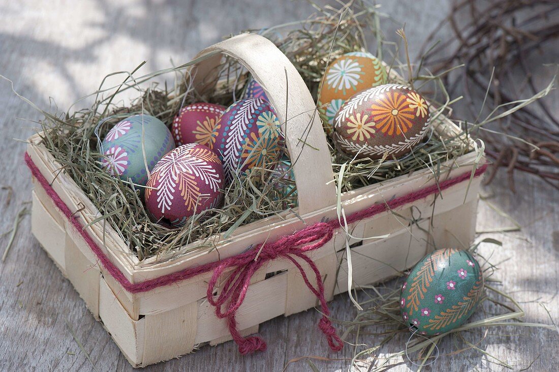 Egg coloring with wax reservation technique