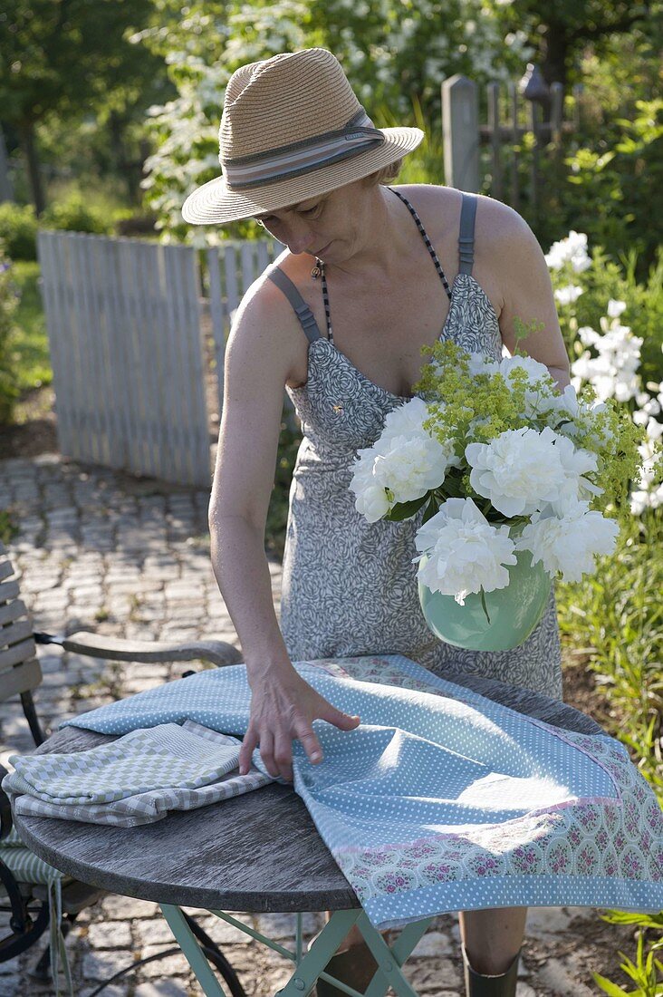 Small sitting area with bouquet of peonies