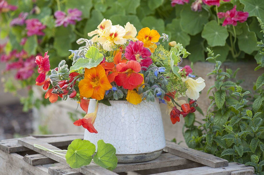 Bouquet of edible flowers and herbs