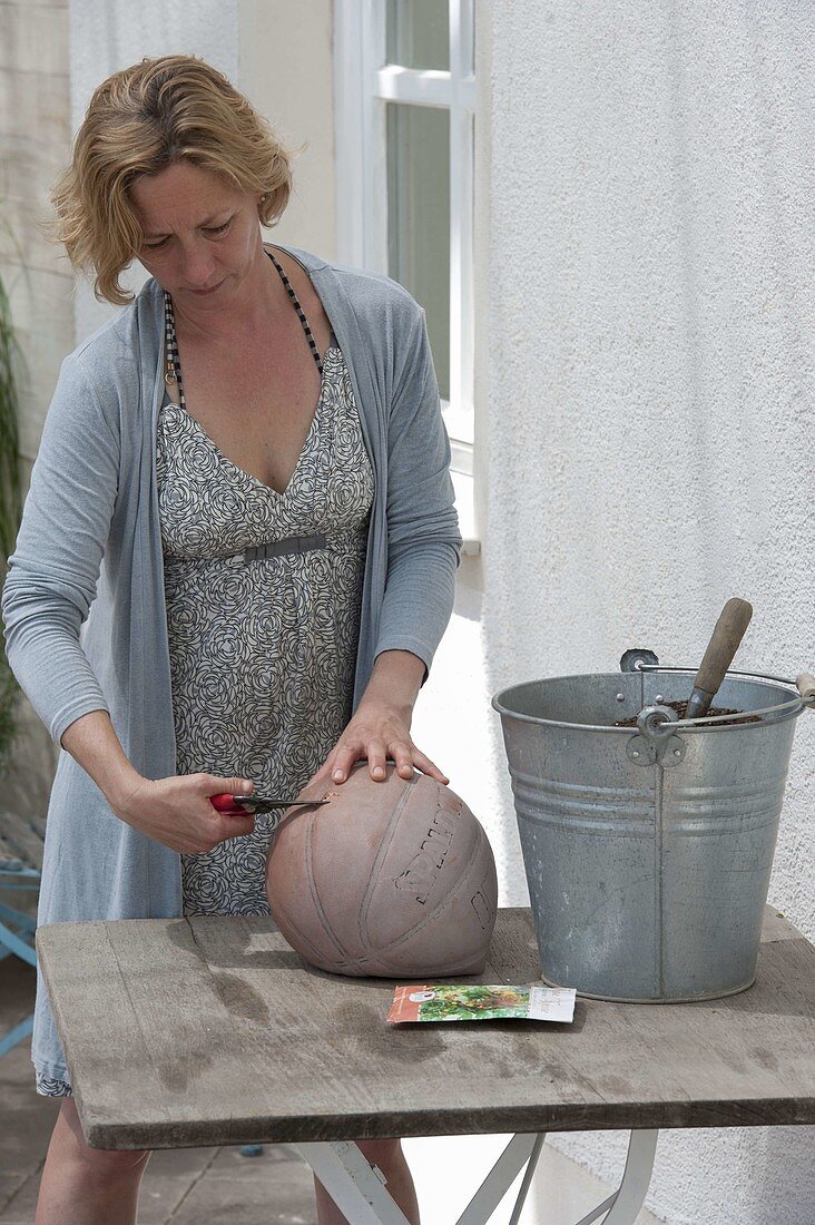 Use an old ball as a planter