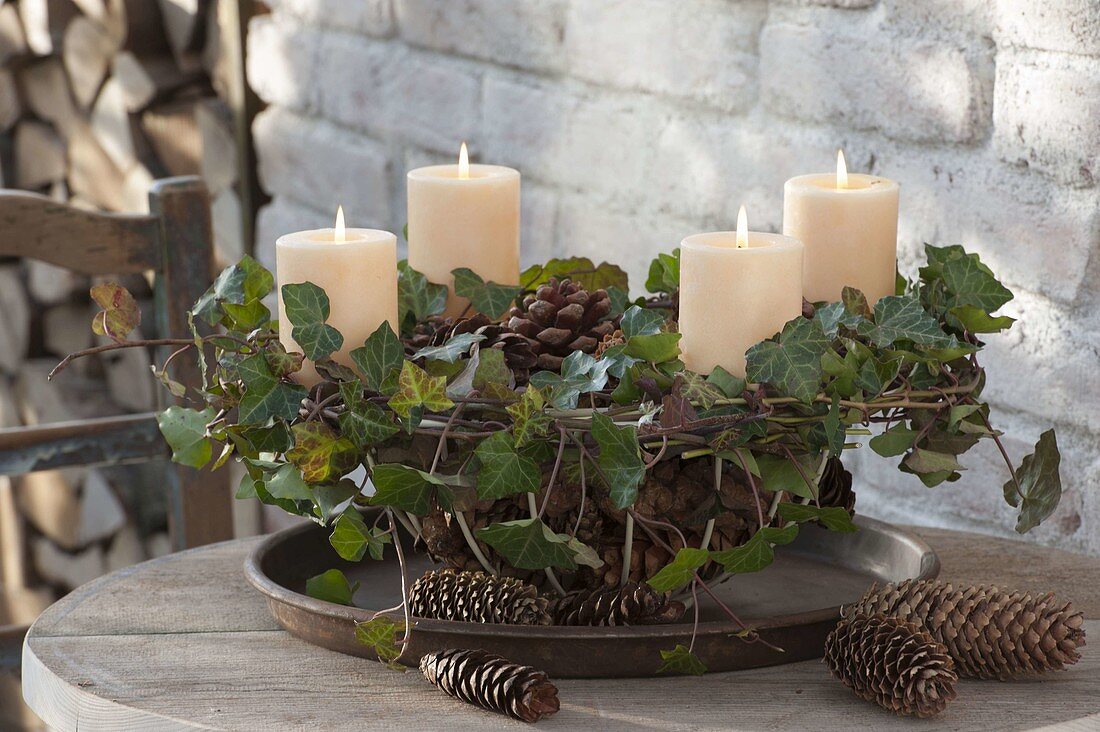 Natural Advent wreath made from tendrils of Hedera (ivy) and cones