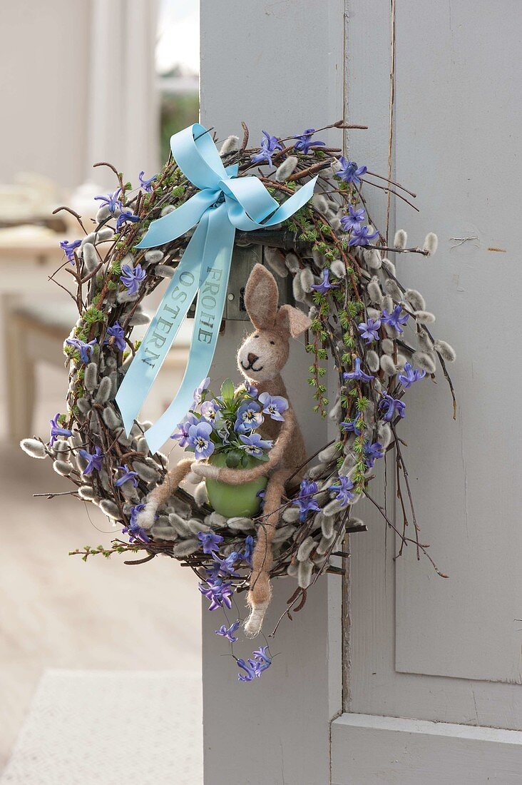 Egg-shaped Easter wreath of branches of Salix, Betula