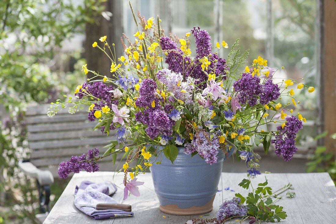 Bouquet of syringa, aquilegia, ranunculus