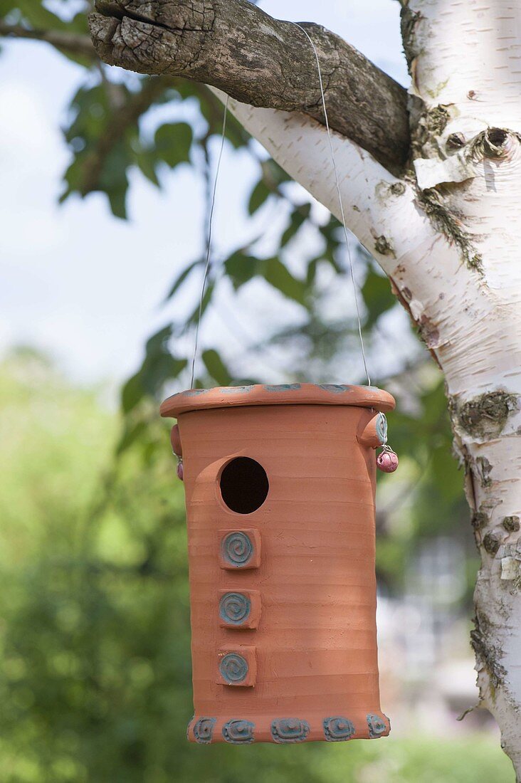 Hand-made nest box for tits on the tree