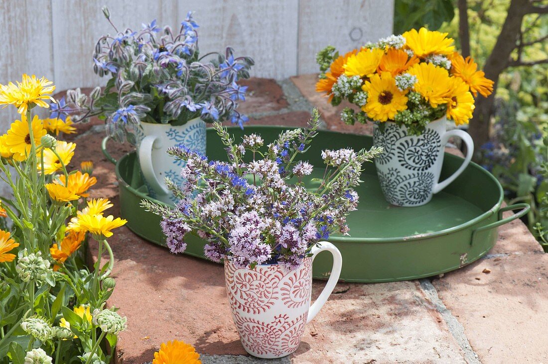 Small herb bouquets in cups