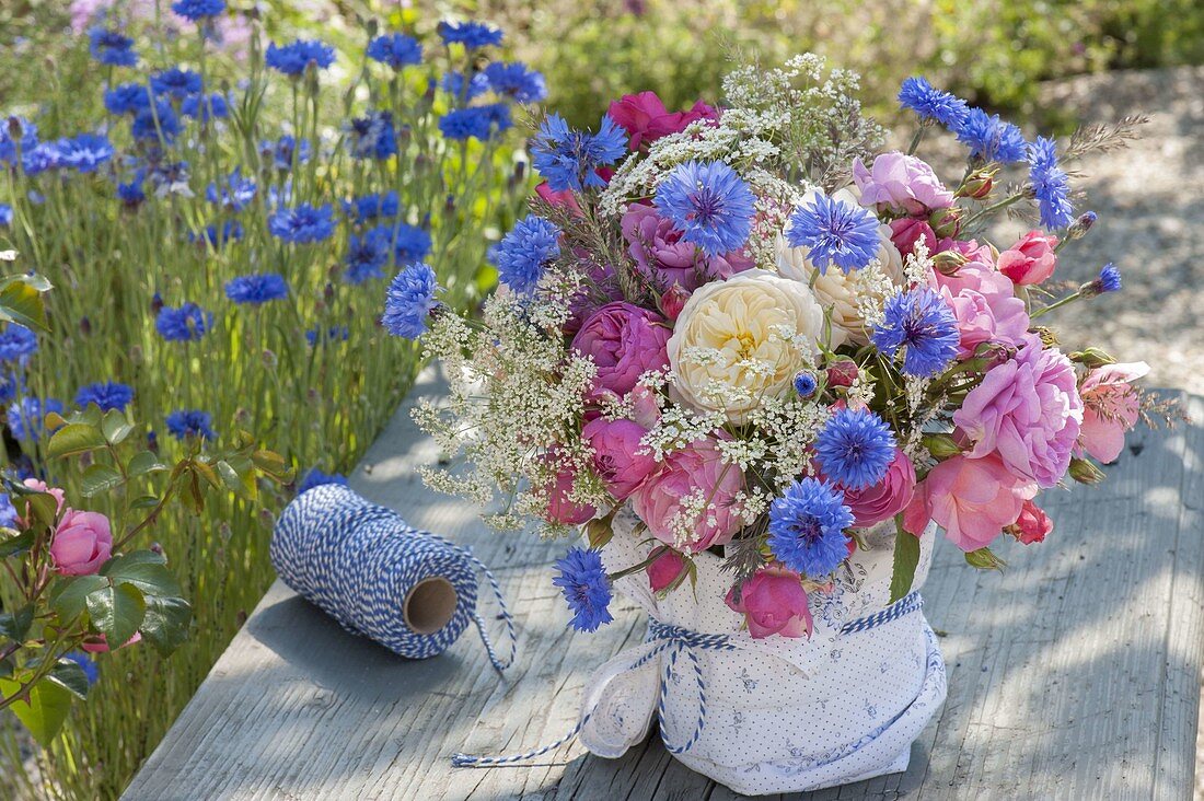 Fragrant bouquet of Centaurea cyanus (cornflowers), Rosa (roses)