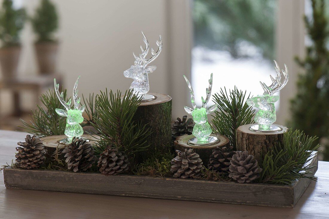 Christmas forest decoration with colored LED light deer