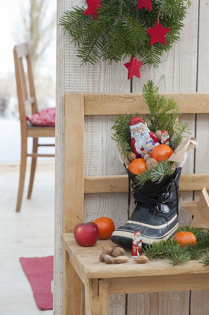 St. Nicholas boots filled with tangerines, apples, Nikolaeus